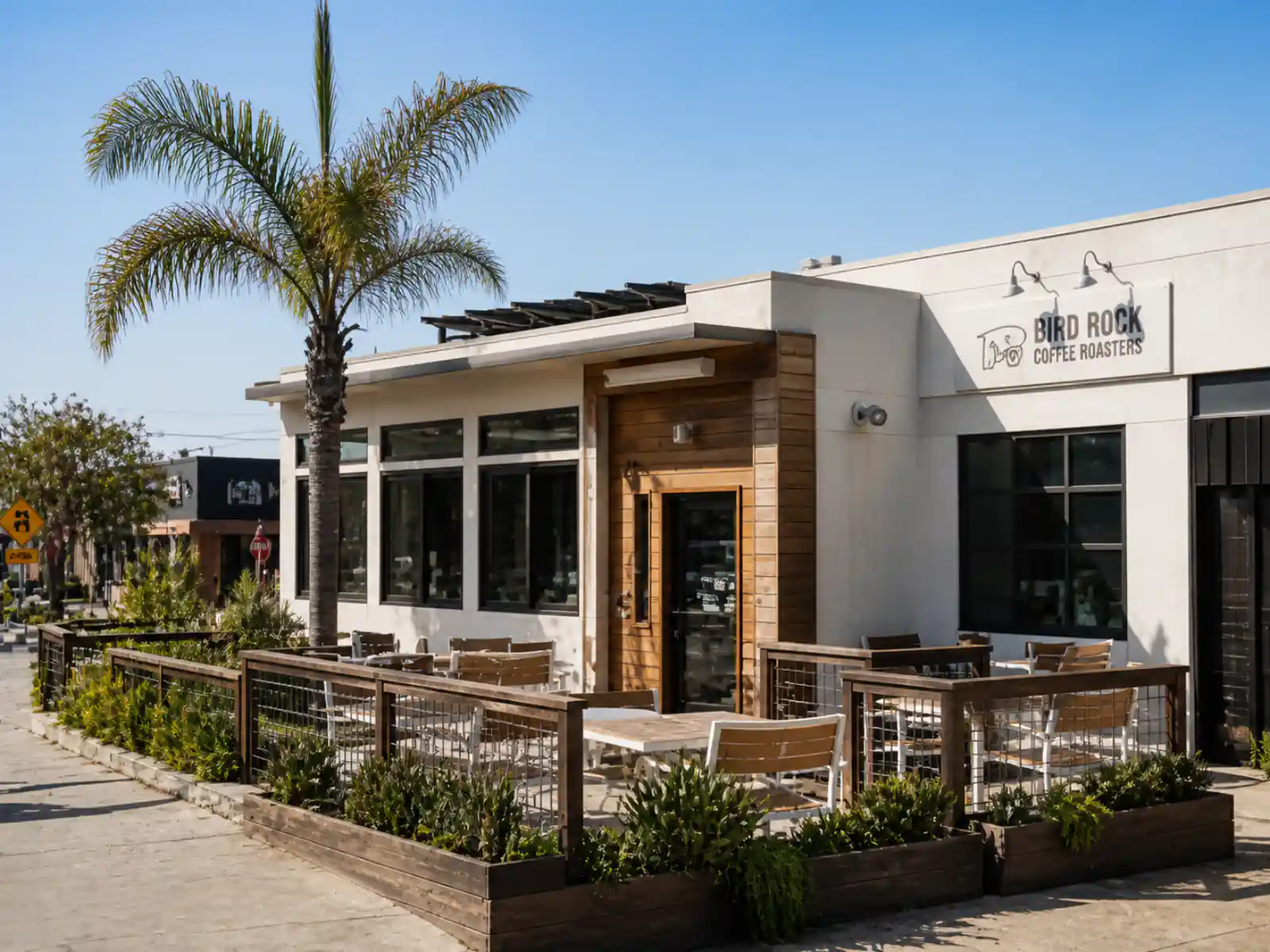 Bird Rock Coffee Roasters café in La Jolla with surf-town light and a cold brew on the counter