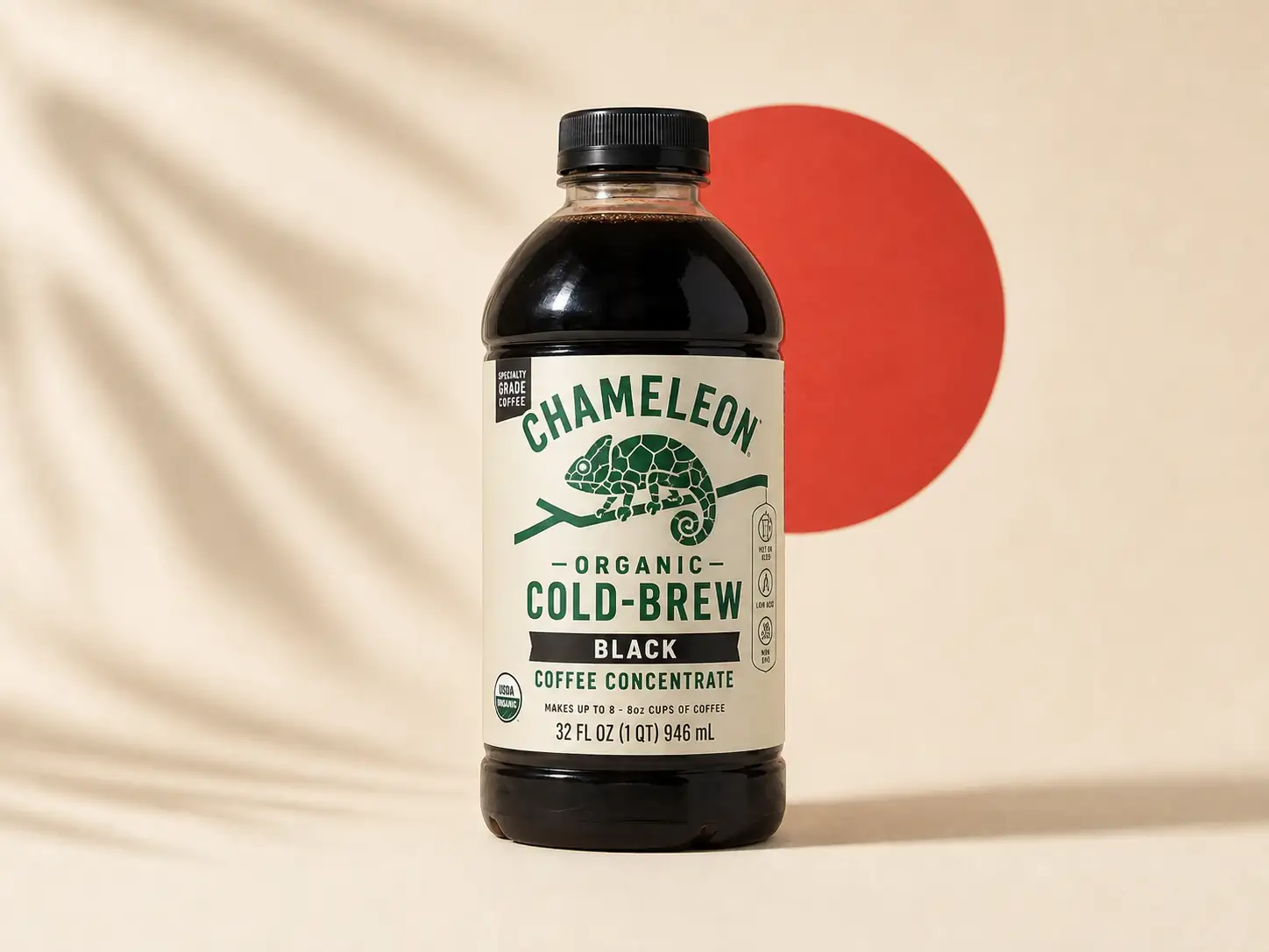 Chameleon Organic Cold-Brew Black coffee concentrate bottle on a cream backdrop with a red circle